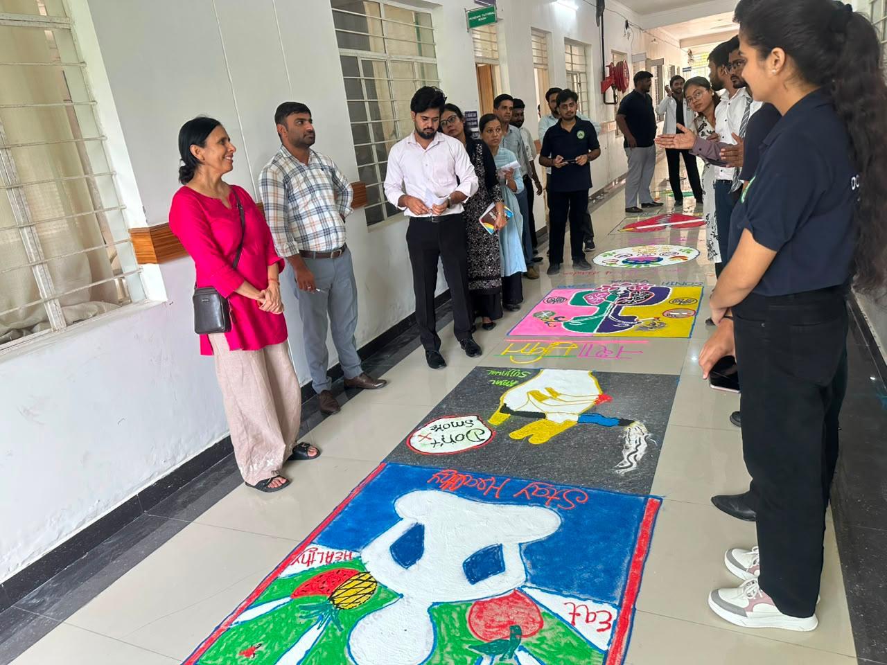 Students participating in a campus rangoli activity