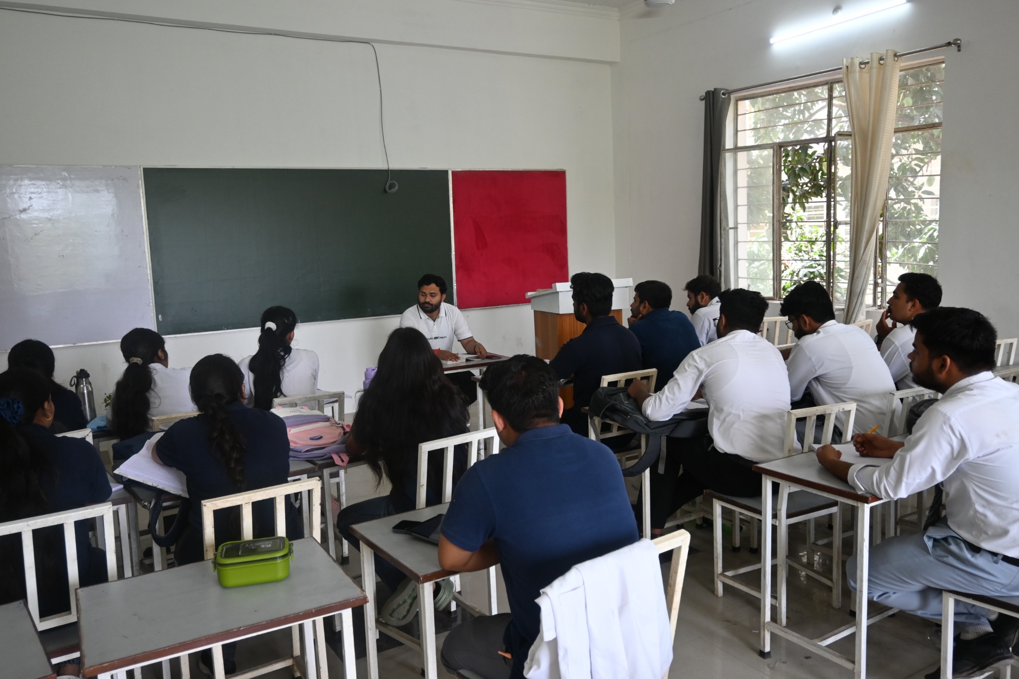 Faculty member teaching BAMS students in a classroom
