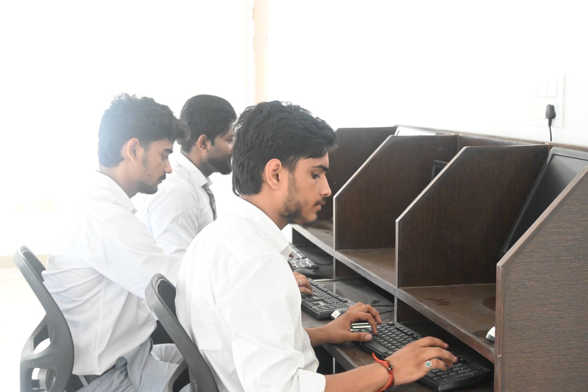 Students working at desktop computers in the college computer laboratory