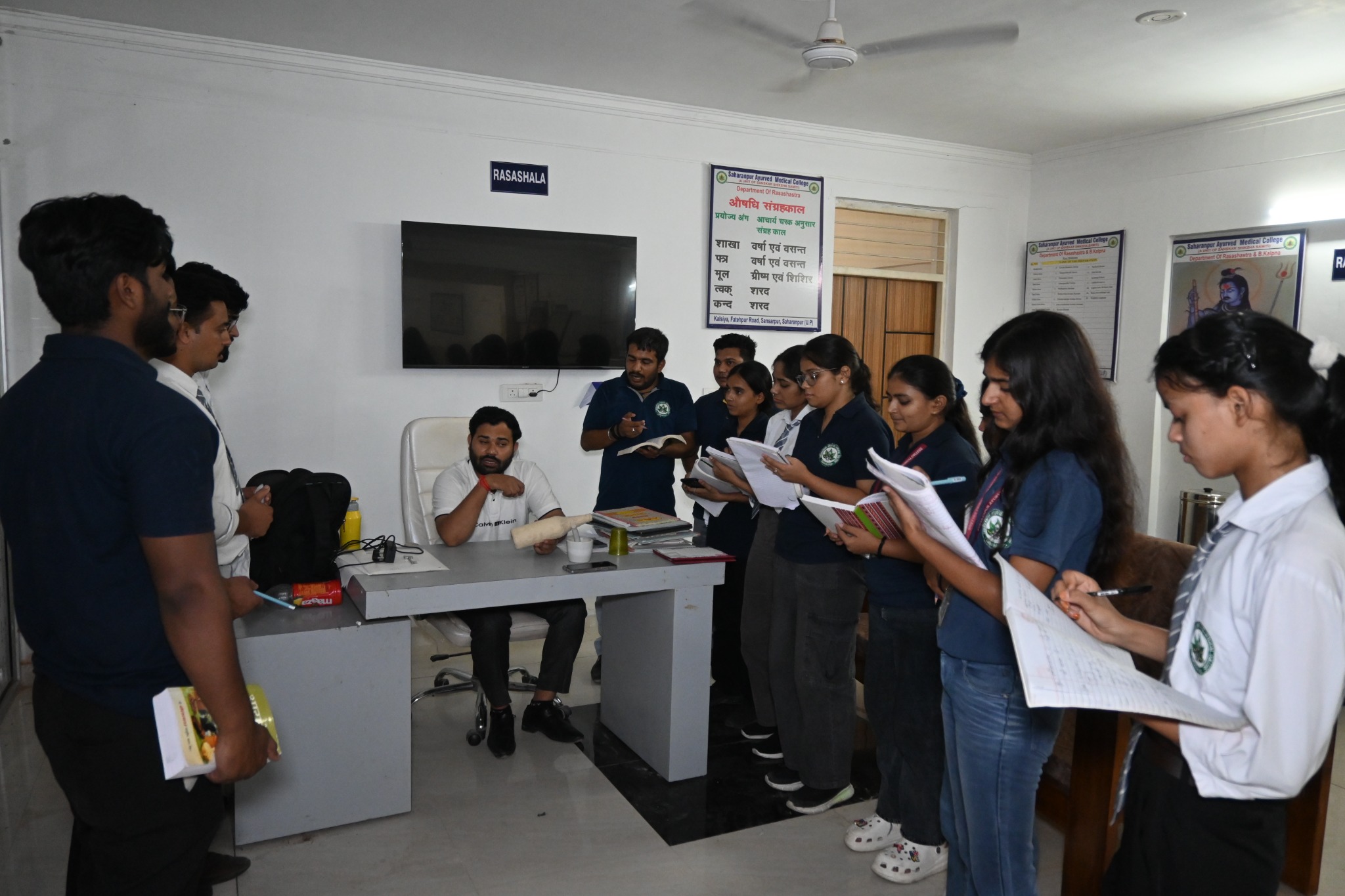 Students attending a guided academic activity in the Rasashala