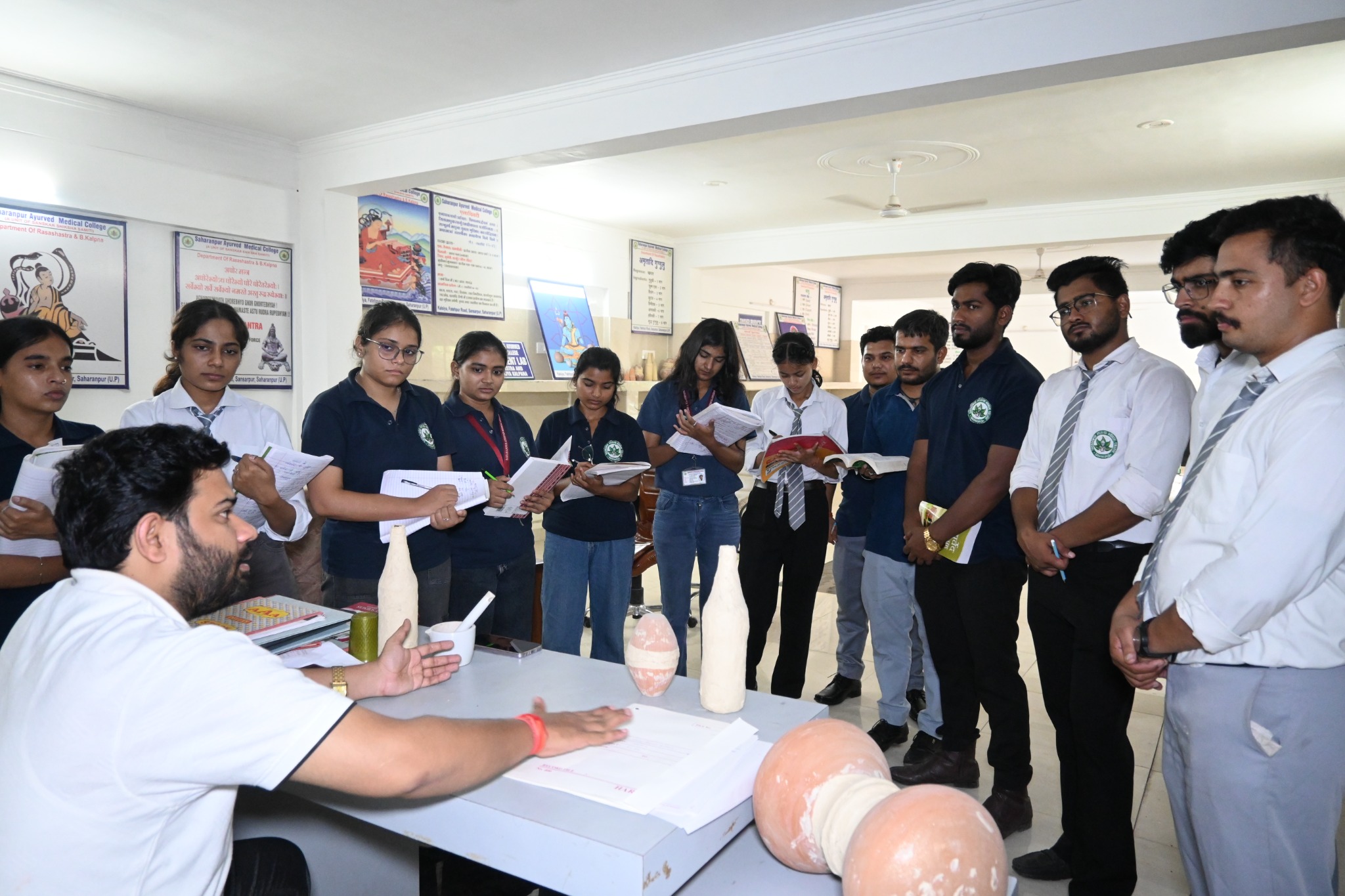 BAMS students attending an Ayurvedic practical learning session