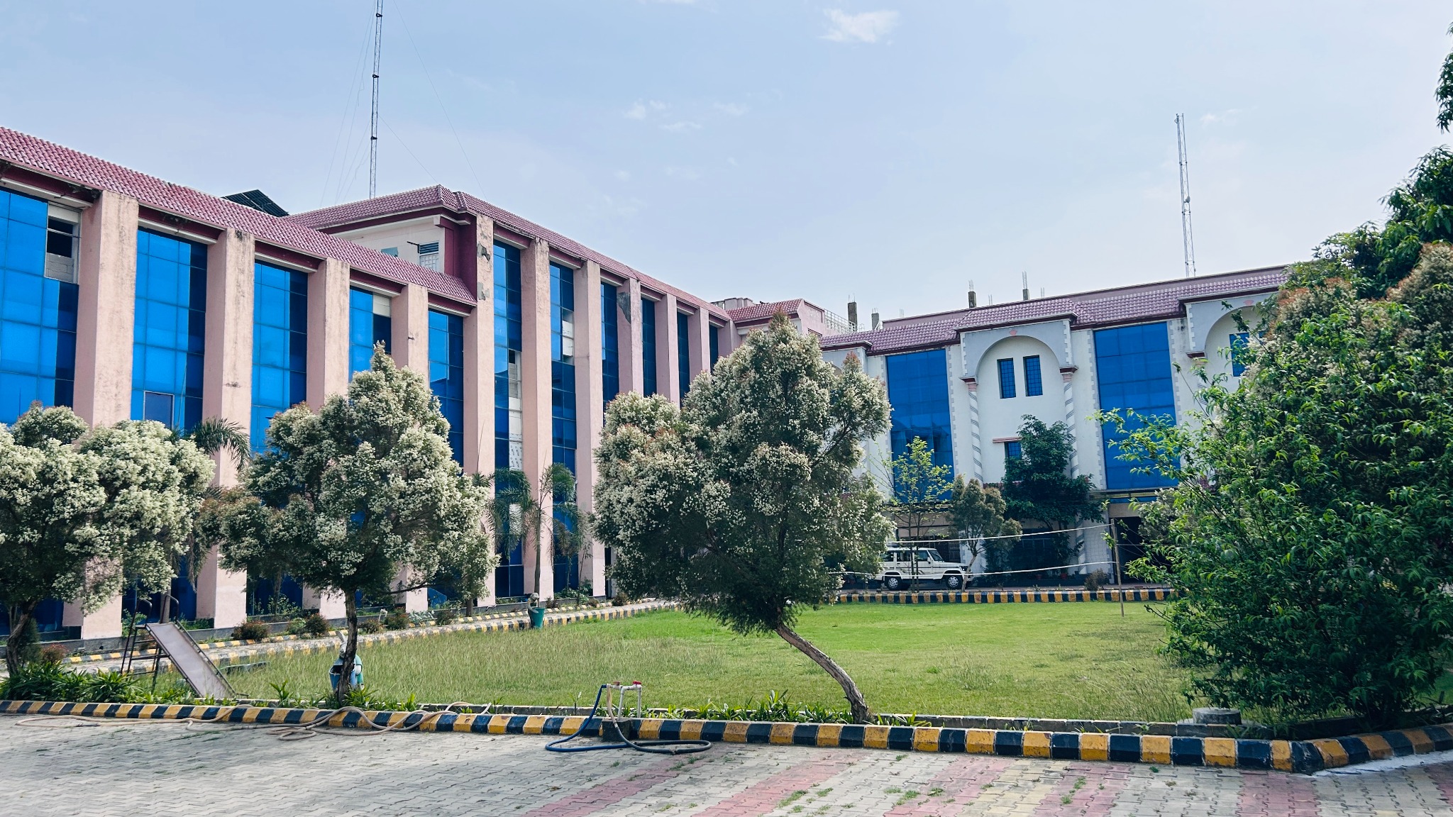 Saharanpur Ayurved Medical College building and landscaped garden